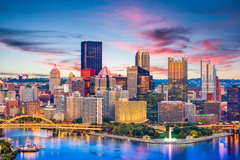 Pittsburgh, Pennsylvania, USA downtown city skyline on the rivers at dusk.